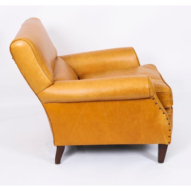 This is a very elegant Art Deco club armchair in a beautiful caramel tan coloured leather, hand-made in England with...