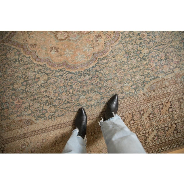 :: Oversized scalloped concentric center medallions atop a covered field in a floral motif. Heavy abrashes across. Colors...