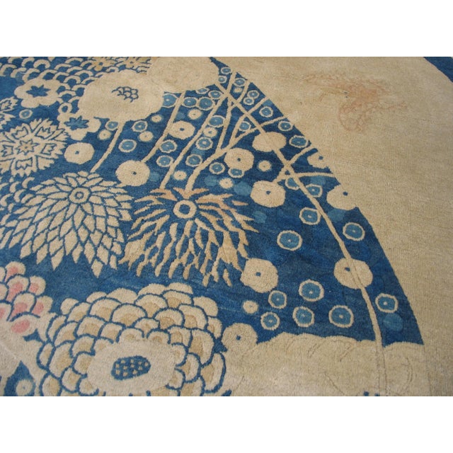 Early 20th Century Pretty Floral Design in a Ivory Field & Navy Border Color Antique Round Chinese Peking Rug For Sale - Image 5 of 6