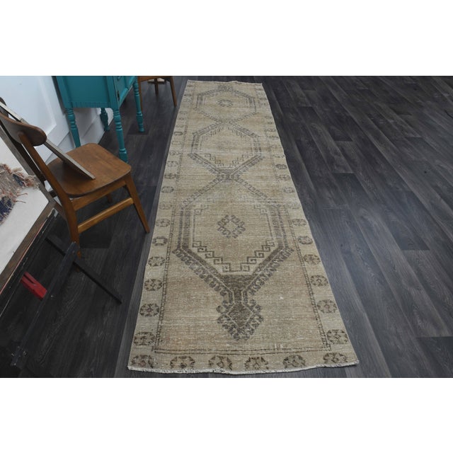 Vintage Hand-Knotted area rug is a semi-antique vintage area rug. The '70s Eastern region of Anatolia's unique rug is...