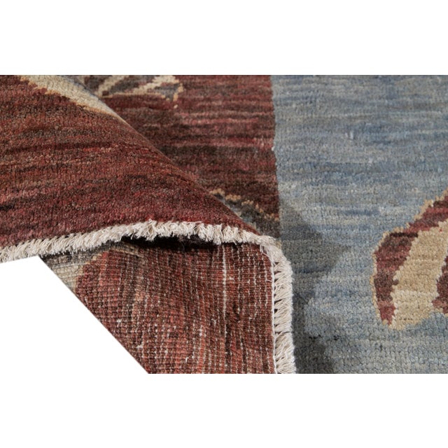 Beautiful Pictorial hand-knotted wool rug with a beige field and multi-color accents in the all-over gorgeous geometric...