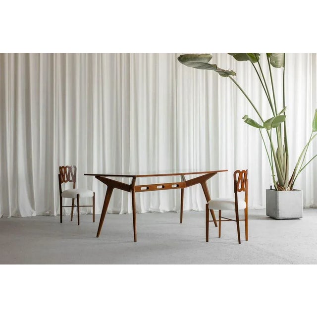 This stunning dining table, made in Italy during the 1950s, is a quintessential example of mid-century Italian design,...