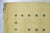 An 8' x 10' hand-knotted wool rug with a plain buttery yellow Gabbeh-style field with a simple dotted border in dark...