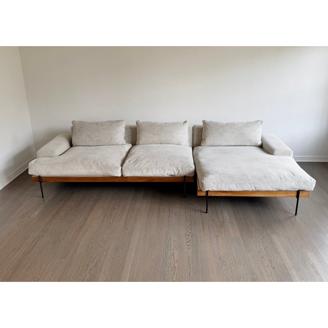 A beautifully crafted two-piece “Rivera” sectional from Croft House, featuring a walnut wood frame, industrial steel legs,...