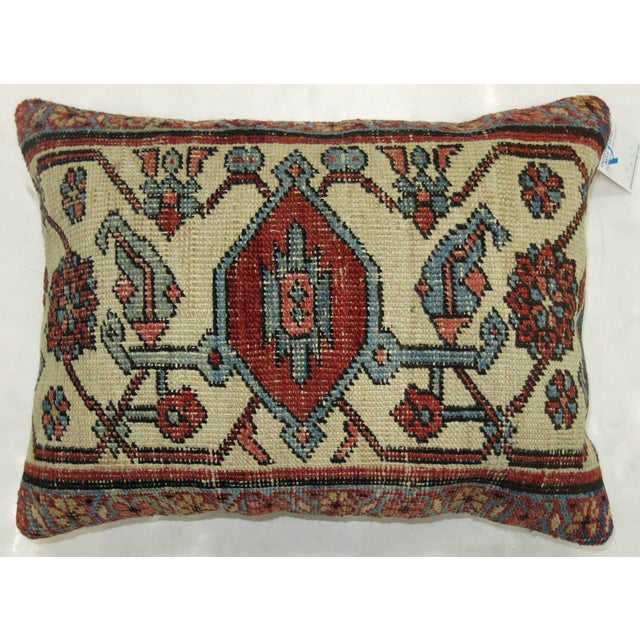Pillow made from a fine quality Persian Serapi rug. Ivory Medallion with red brick , blue and brown accents Measures: 17"...