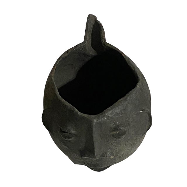 A well carved Kuba wooden cup in the form of a human head. Figural cups such as this cups are among the most popular...