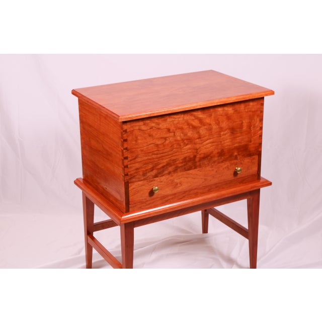 The cherry chest on stand features hand cut dovetail joinery made to order in our shop. The chest and stand together...