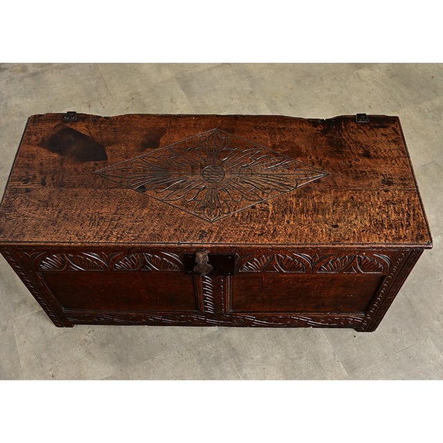 A French, solid oak coffer from the 1800s or earlier, this heavy storage trunk has a paneled exterior counterbalanced with...