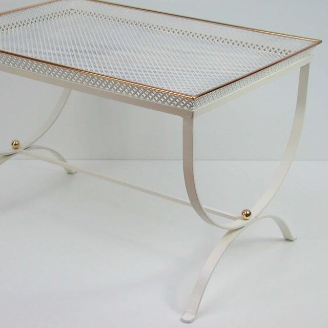This 'Snow White' side table was designed and manufactured in France in the 1950s. It is made of white lacquered...