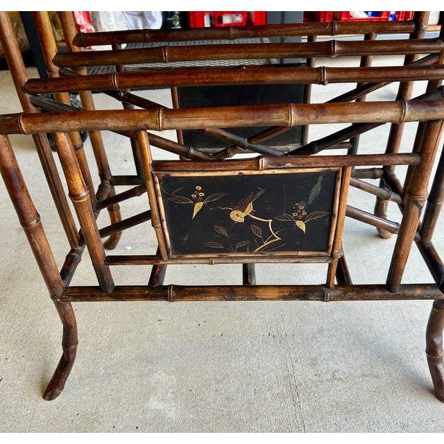 This item is a 19th-century Anglo-Japanese bamboo side table featuring a lacquered top with chinoiserie motifs. Material:...
