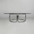 Italian modern coffee table in steel and glass, 1970s Coffee table with a round glass top. The frame is made entirely of...