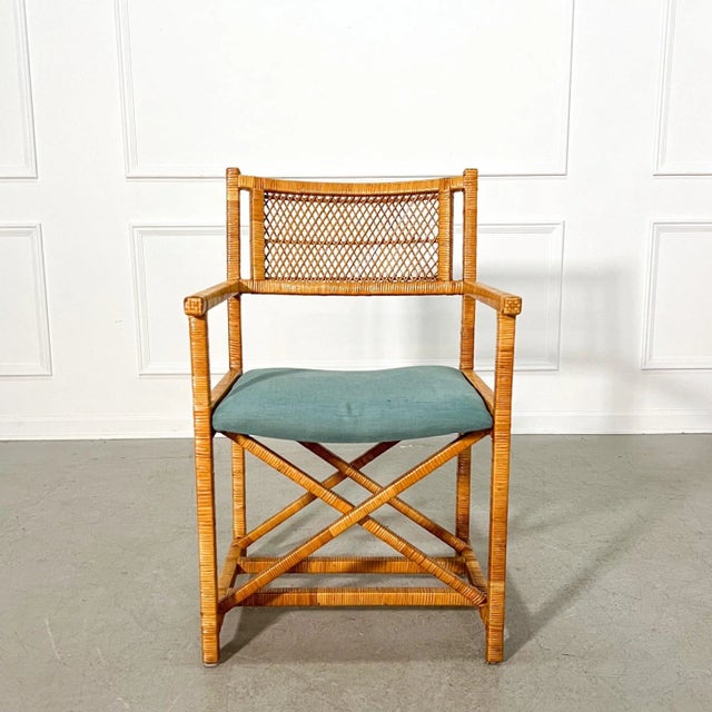 A cheerful set of 4 rattan wrapped cane back director’s chairs in the style of McGuire. Well crafted and sturdy...