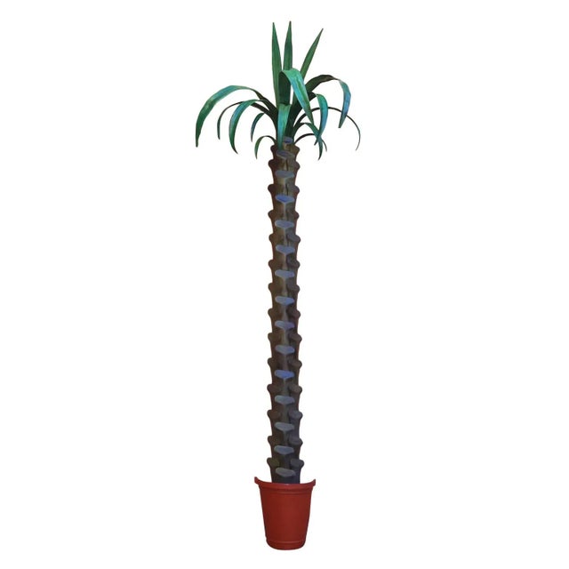 Standout life sized pair of vintage tole or painted metal wall mounted palm tree sculptures with plenty of decorative appeal.