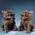 This is a matching pair of cast bronze figurines in the form of Qilin (mythical hooved chimeras), featuring high-relief...