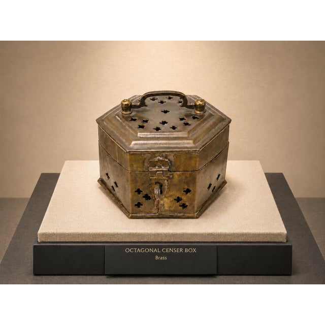 A charming vintage hand-hammered brass incense censer featuring a hexagonal form, pierced quatrefoil ventilation motifs,...