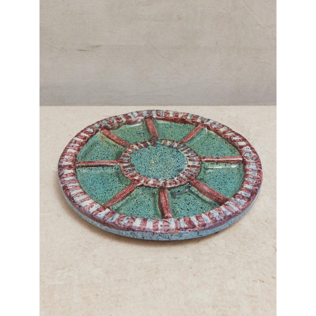 Beautiful 9.3 inch segmented hand made pottery plate. I can see this as a striking wall hanging for a plate wall, and I...