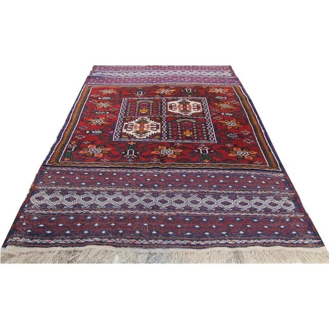 Handwoven Ghochan rug featuring a panel design on a multi-colored field and border accented in shades of brown, ivory,...