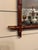 This is a French antique faux-bamboo wall mirror with a hand-carved wood frame. The frame is wood that has been shaped and...