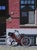 No. 7 by Neil Douglas | Acrylic on board Red bicycle leaning against a brick wall. For Sale