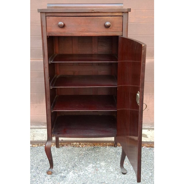 Victorian Solid Mahogany Sheet Music Cabinet, Circa 1880s. Features a top drawer with original wooden drawer knobs....