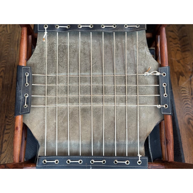 1960s Arne Norell designed "Sirocco" safari chair. Produced by Scanform in Colombia. The black leather and rosewood are a...