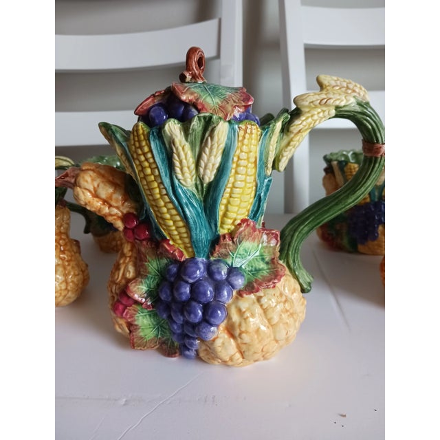 Colorful Teapot/decor with ears of corn, grapes, and gourds. By Fitz and Floyd, dated 1995. 32 oz. Teapot, each mug is...