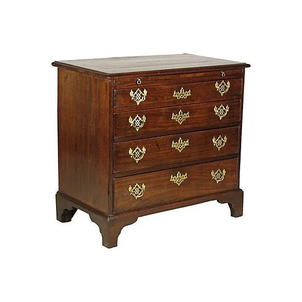 An 18th-C. English George II mahogany bachelor's chest with a pullout brush slide over four graduated drawers. Original...