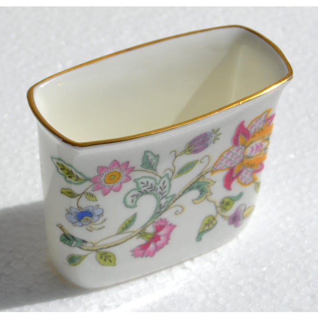 1960s Minton Haddon Hall Cigarette Holder made of fine bone china, decorated with a colorful floral pattern and edged with...