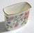 1960s Minton Haddon Hall Cigarette Holder made of fine bone china, decorated with a colorful floral pattern and edged with...