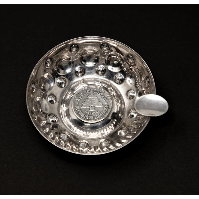 Offering this sterling silver wine taster with a Republic Libanaise coin. Has lots of hand crafted raised dots.