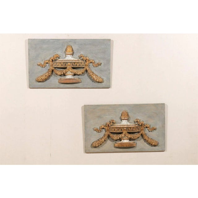 An Exquisite Pair of Italian 19th Century Painted Wood Plaques with Gilded Carving of Urn Decorated with Swag, Pinecone...