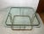 For sale is this nice mid century style coffee table made out of metal and glass. The table was made around the 80s