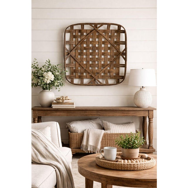 A large square decorative tobacco basket by Ballard Designs, measuring approximately 36 inches square. Designed as wall...