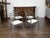 A set of four vintage Italian metal armchairs from the mid 20th century, with brass rams' heads and new upholstery....