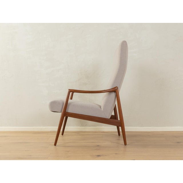 Classic armchair by Hartmut Lohmeyer for Wilkhahn from the 1960s. High-quality frame in dark-stained beechwood. The...