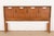 A beautiful Mid-Century Modern sculpted walnut queen size headboard From the Mayan Collection by Bassett Furniture USA,...