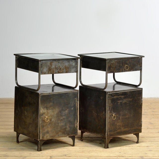 This set of iron bedside tables with a glass top exudes history and style. Originally from a hospital in the 1950s, they...