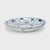 This 19th-century porcelain plate is hand-painted with cobalt underglaze in the blue-and-white manner, loosely brushed...