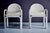 Pair of Orsay armchairs by Gae Aulenti for Knoll, 1975. Made of white leather and lacquered steel, these chairs feature a...