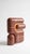 The smallest lamp in the collection, and often the first one people reach for. Its folded form hides the source entirely,...