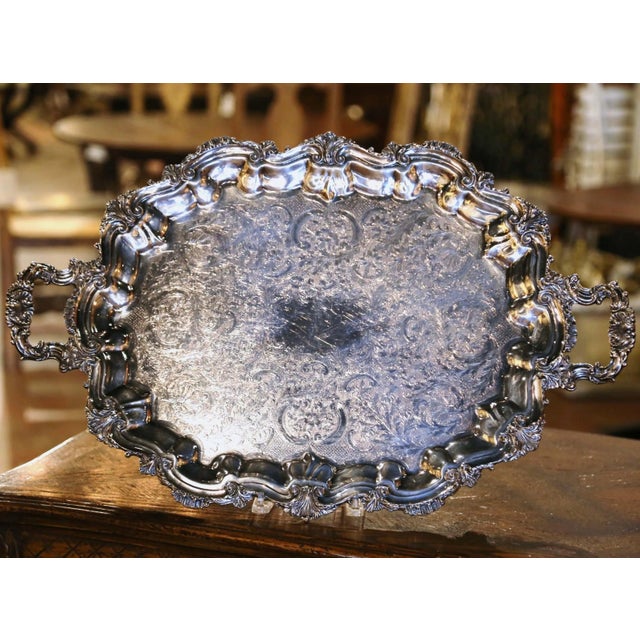 Elaborately decorated in the Louis XV tradition, this large vintage serving tray combines graceful proportions with...