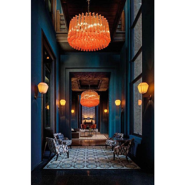 Fabulous murano glass chandelier with more than 200 coral color triedri on brass frame. Dimensions: 43.30 inches (110 cm)...