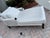 Modern design woven chaise lounge with mattress and pillow.