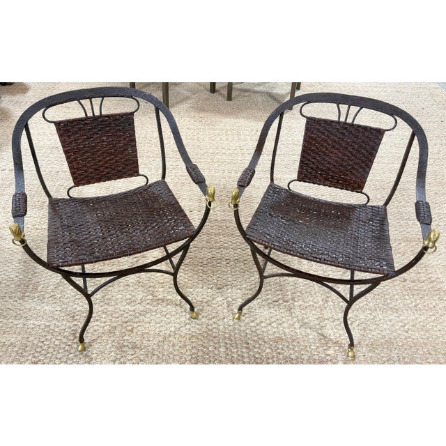 A beautifully executed and highly sculptural pair of Maison Jansen–style curule armchairs, France, circa 1960s,...