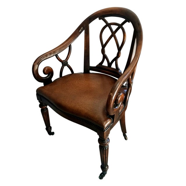 Regency Style Mahogany Leather Armchair. tub shaped open back with interlacing splat, similarly carved scrolling arms,...