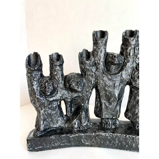 Here is a fantastic mid-century Brutalist menorah, designed in 1965 by American sculptor Ellen Lord for Austin...