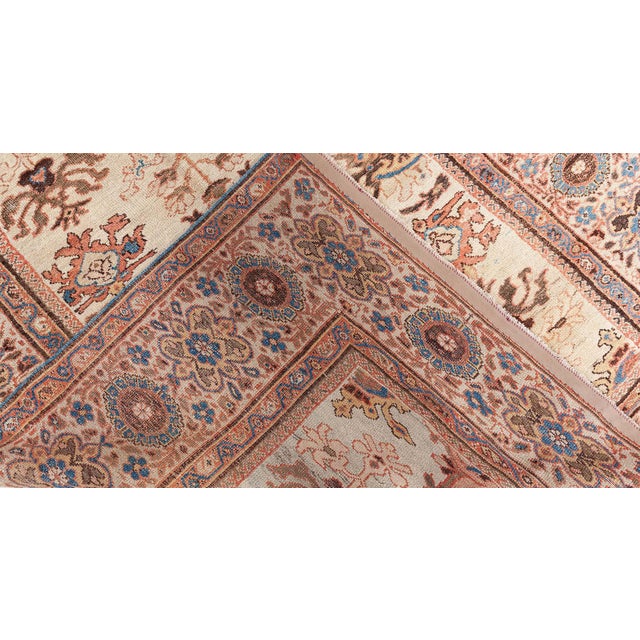 A late 19th century Persian Sultanabad rug witgh a clean clear Ivory field . Abstract floral shapes are rendered in...