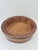 A large, striking bowl made using traditional cooperage techniques from wooden staves, reinforced with two wide metal...