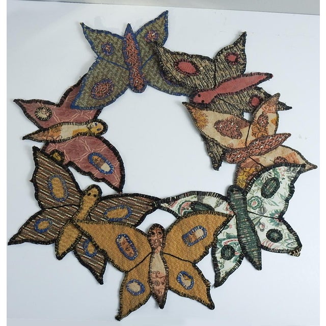 Group of 7 folk art handmade butterfly appliques. Made with drapery weight fabric, some with metallic threads, some...