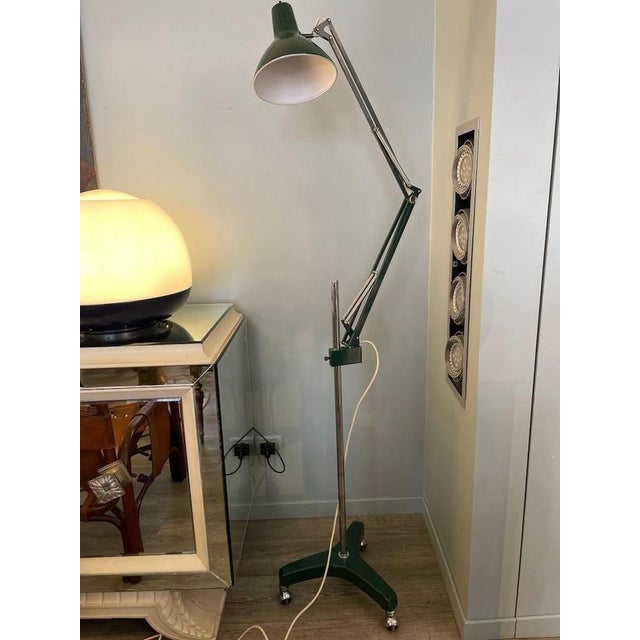 Floor lamp model Naska from 1970. The lamp is adjustable in height and swivelling and is made of enamelled metal and...